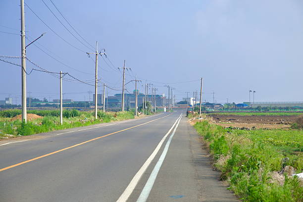 istock Straight Road Through Farmland 2232452344