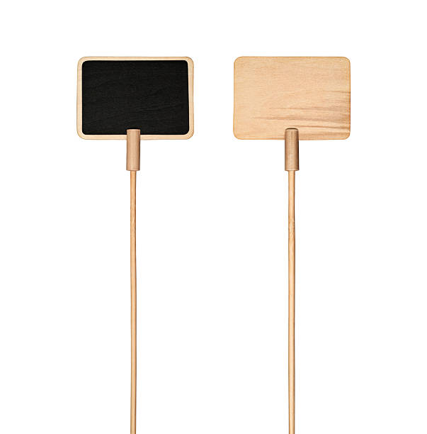 istock Two blank wooden signs on sticks isolated on white. 2232455107
