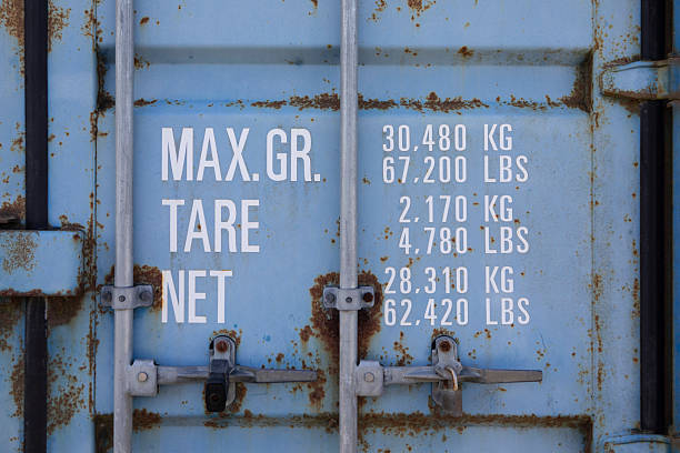 Lettering on a light blue coloured cargo container