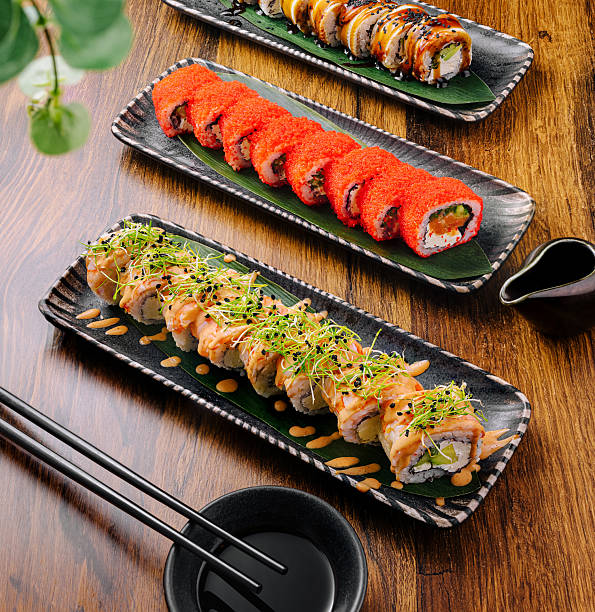 istock Delicious sushi platter with various rolls served on elegant plates 2232459896