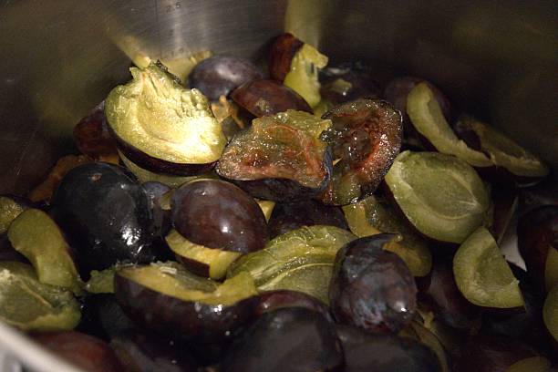 istock Plum jam cooking, chopped plums in pot, close up 2232462866