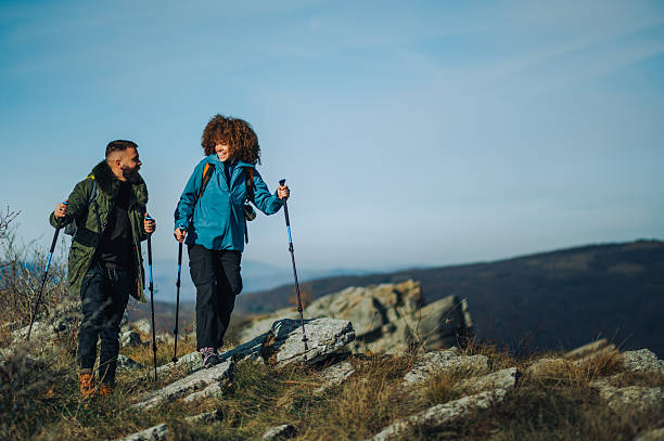 istock Hikers walking on mountain ridge on sunny day 2232463727