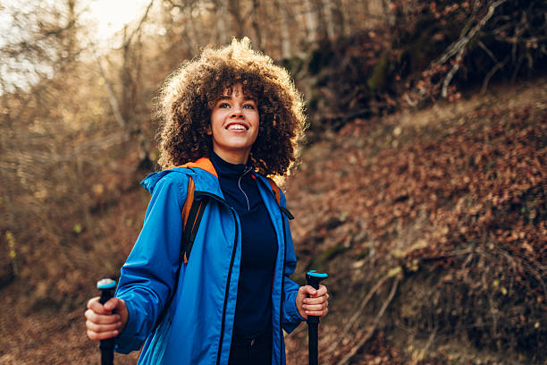 istock Young female hiker exploring autumn forest trail 2232463886