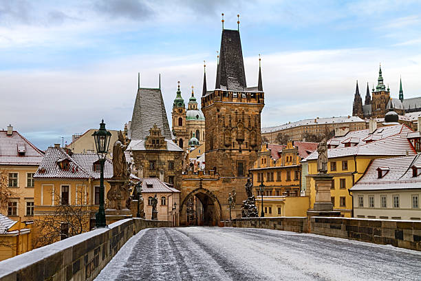 istock Charles bridge in Prague covered with snow 2232464295