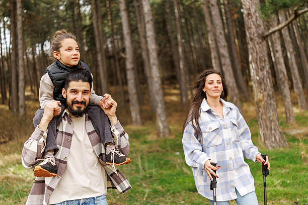 istock Family on hiking adventure in pine forest 2232464548