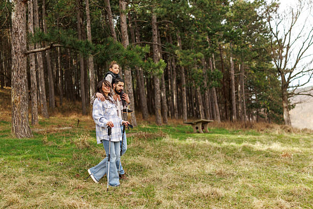 istock Family on hiking adventure in pine forest 2232464713