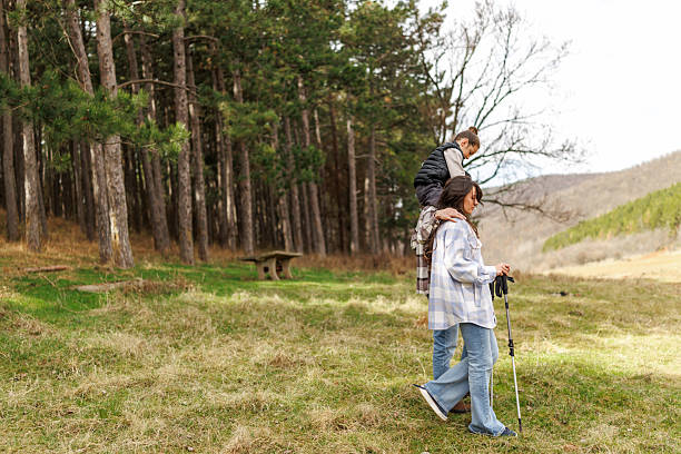 istock Family on hiking adventure in pine forest 2232465064