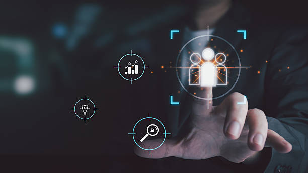istock A businessman touches a virtual interface to select a target audience, symbolizing customer targeting, recruitment, and human resources (HR) technology. 2232465258