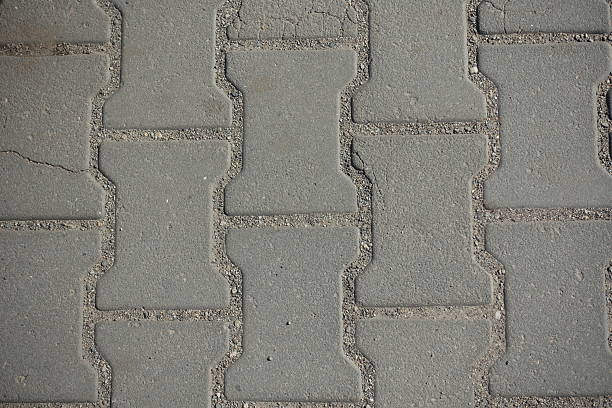 Close view of gray concrete dumble interlocking pavement