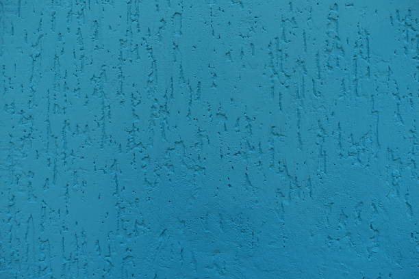 Backdrop - turquoise blue wall with stucco worm finish