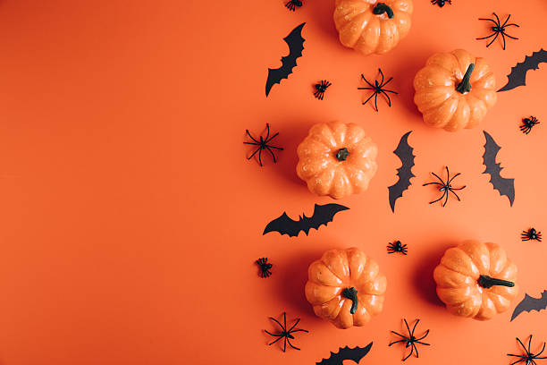 istock Halloween decorations on the orange background. Flat lay concept, top view, copy space 2232473550