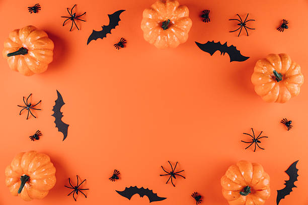 istock Halloween decorations on the orange background. Flat lay concept, top view, copy space 2232473738