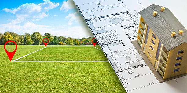 istock BUILDING PROJECT CONCEPT WITH LAND PLOT, FLOOR PLAN, AND HOUSE MODEL - Real estate planning, architecture design, and land development concept for construction and investment use 2232474413