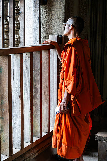 Magelang, Central Java, Indonesia, 31 May 2023 : A monk wearing his robes, to take part in Pindapata
