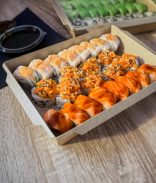 istock Assorted Sushi Rolls with Salmon, Tuna, and Sauce 2232479387