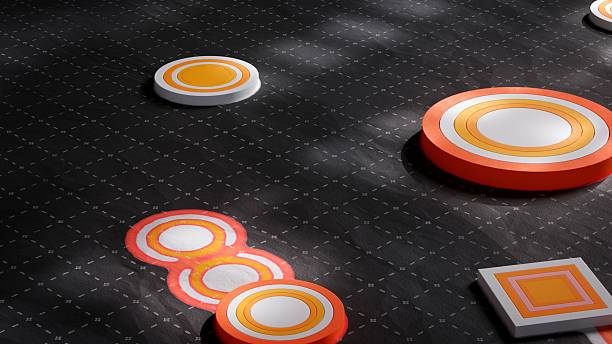 istock 3D abstract composition with floating orange and yellow discs placed over a dark textured surface. The elements appear to hover in a futuristic arrangement, perfect for modern digital design and creative visuals. 2232480694