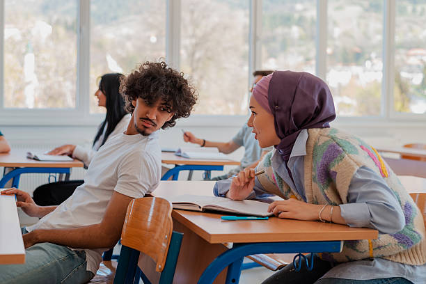 istock In the classroom group of college students engages in discussion and knowledge exchange. 2232480775
