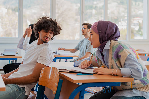 istock In the classroom group of college students engages in discussion and knowledge exchange. 2232482031