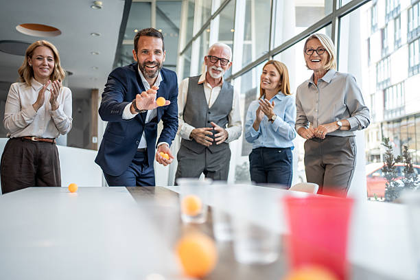istock Business team playing beer pong in the office 2232483530