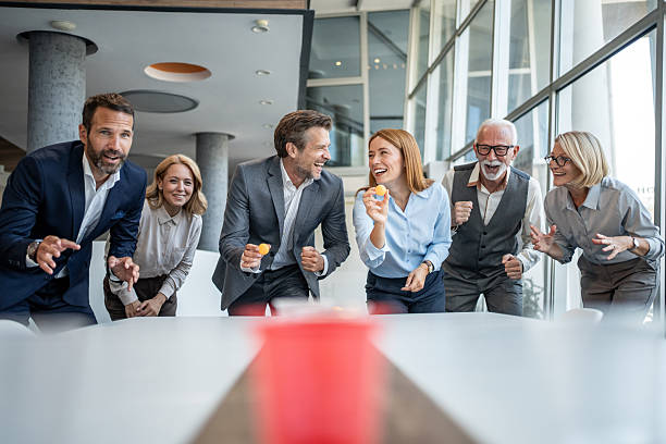 istock Business team playing beer pong in the office during break time 2232484365