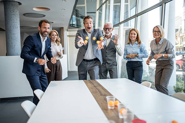 istock Business team playing beer pong in the office during break time 2232484407