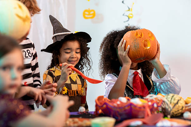 istock Children Pumpkin Carving Together 2232484910