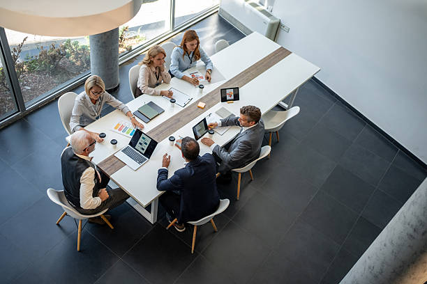 istock Business people working together at meeting table 2232485032