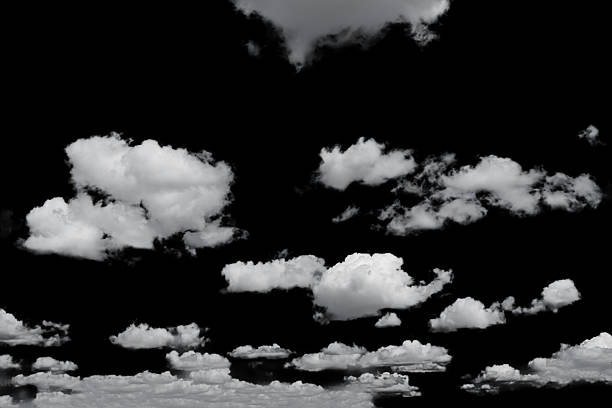 istock white fluffy clouds isolated on a black background, clipart 2232485931