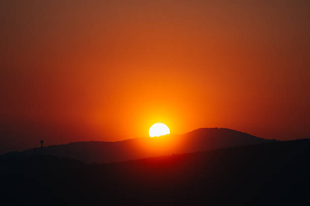 Beautiful red sunset over the hill
