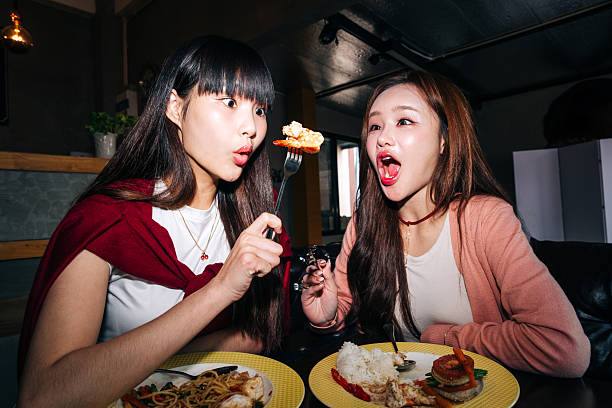 istock Funny moment between friends during shared meal 2232487961