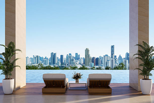 istock Luxury infinity pool with city skyline view 3d render 2232488110