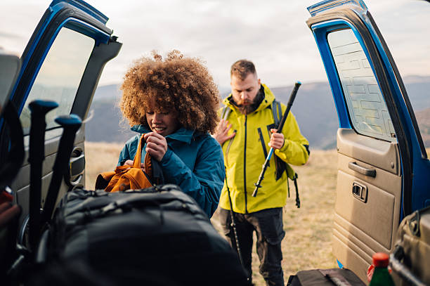 istock Hikers preparing backpacks for trekking in mountain landscape 2232488544