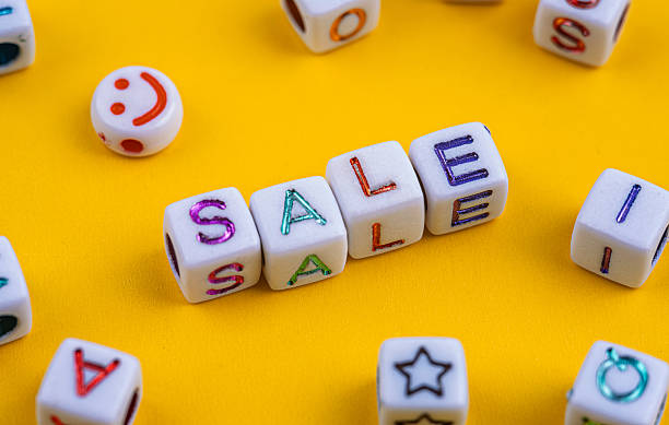 White letter beads spelling SALE in colorful letters.