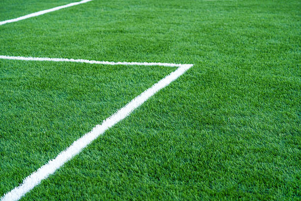 istock Soccer playground with artificial grass and white stripe 2232492634