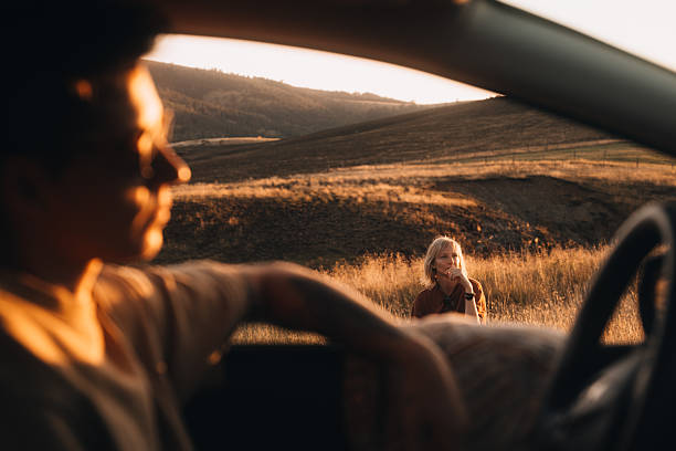 istock Travel Scene with Two People at Sunset 2232494133