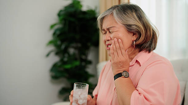 istock Teeth sensitivity from drinking cold water in a senior woman 2232495461