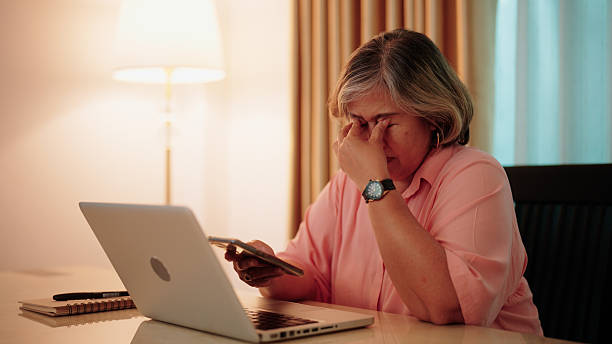 istock Asian older woman experiencing digital fatigue after extended smartphone use 2232495674