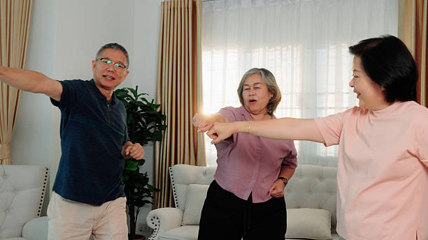 istock Three senior adults are doing light exercise and aerobic movements at home to maintain good health 2232495934
