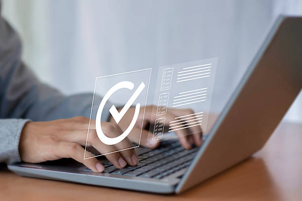 istock Digital document approval checklist on laptop screen. Productivity and business technology concept. Document validity management and online surveys. Enterprise business technology. 2232496153