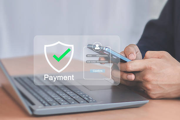 istock Secure Online Payment Process with Mobile Phone and Laptop 2232496192