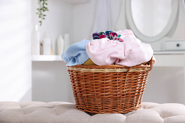 istock Laundry detergent and clothes in basket indoors 2232498174