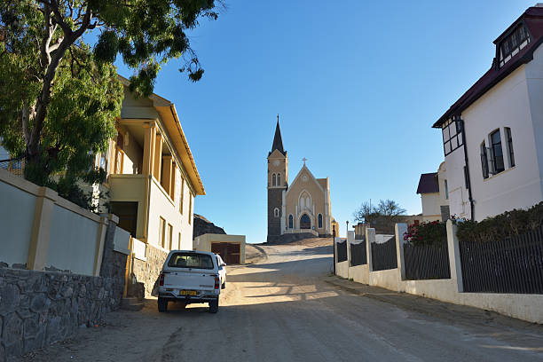 Luderitz, Namibia - Jan 27, 2016: Street to Evangelical Lutheran church is affectionately known as the Felsenkirche or church on the rocks. It is highest placed building in town of Luderitz