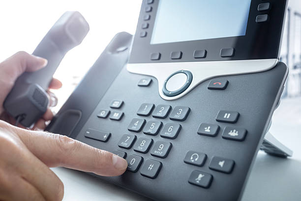 istock Dialing a telephone in the office, communication, contact us and customer service support 2232501444