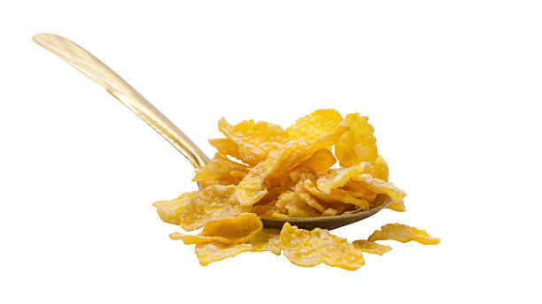 istock Golden Cornflakes on Spoon Isolated no background. 2232503644