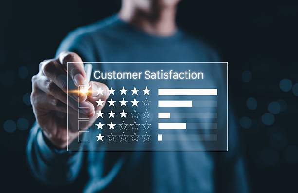 istock Customer satisfaction rating concept with a person selecting stars on a virtual interface, representing feedback, service evaluation, and experience metrics in a digital business environment. 2232504107