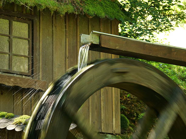 Running mill wheel in the spa park of Bad Wildbad in the Northern Black Forest in Baden-Württemberg (Germany).
