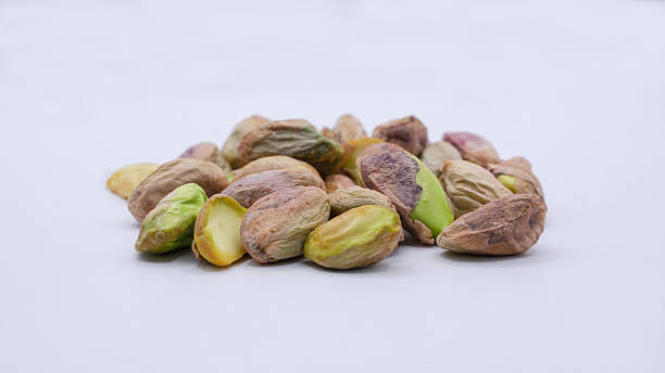 istock Pile of Shelled Pistachio Nuts Isolated on White Background 2232506249