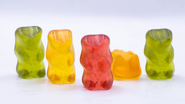 Colorful jelly gummy bears standing together