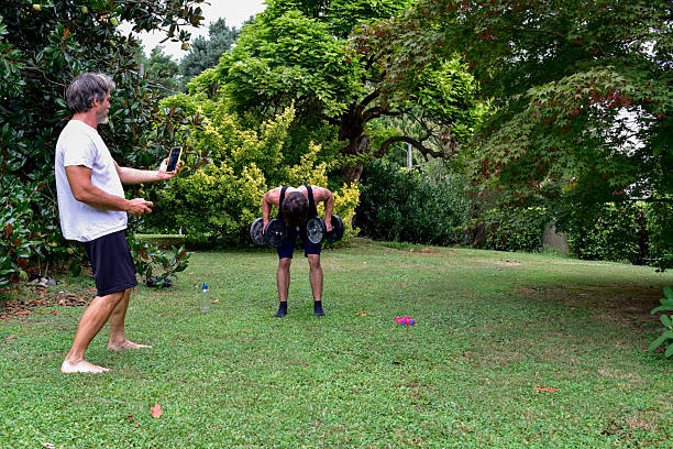 istock Outdoor workout with weights in a garden setting during summer 2232514004
