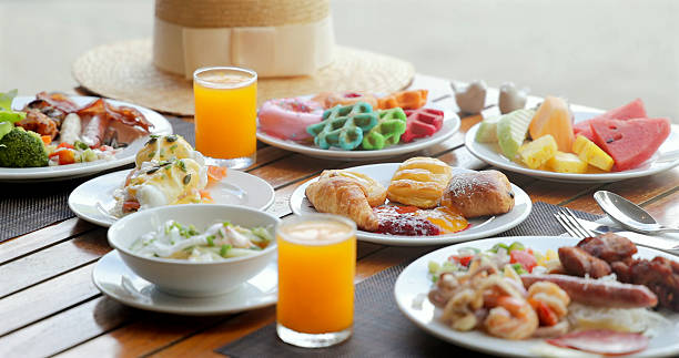 istock Breakfast buffet on outdoor wooden table, featuring fresh fruit, 2232515967